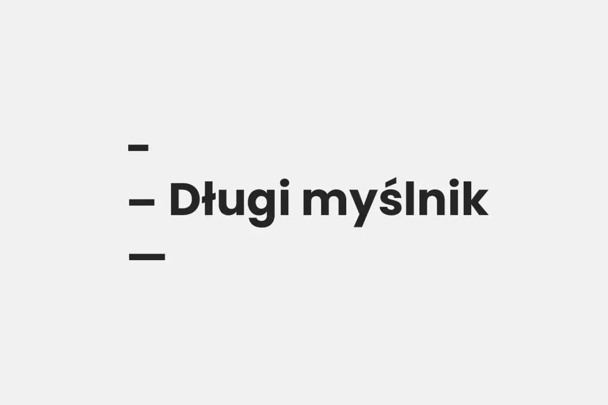 Trzy kreski, a między nimi tekst "Długi myślnik". Wygląda jak przykład półpauzy na klawiaturze.