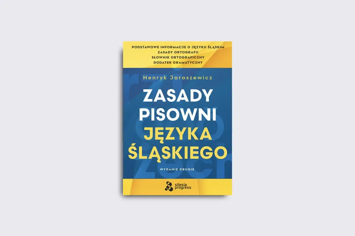 Okładka książki "Zasady pisowni języka śląskiego" Henryka Jaroszewicza. W tle subtelny ukośnik.